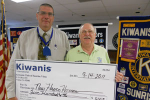 Kiwanis members holding large check for New Haven