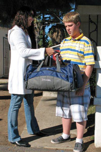 Youth receiving a journey bag.
